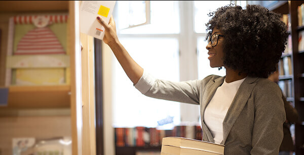 Woman shelving books